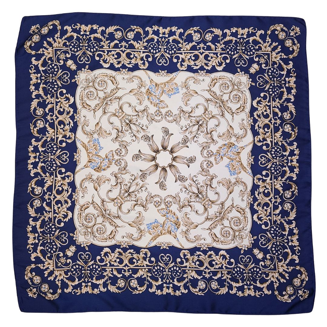 Decorative scarf with intricate gold patterns on a blue background