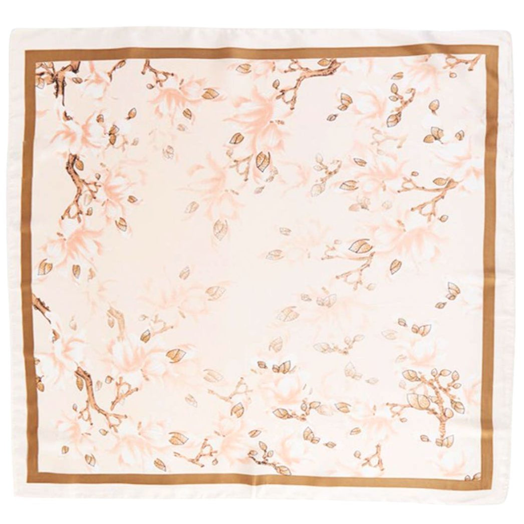 Floral patterned scarf with a gold border on a white background