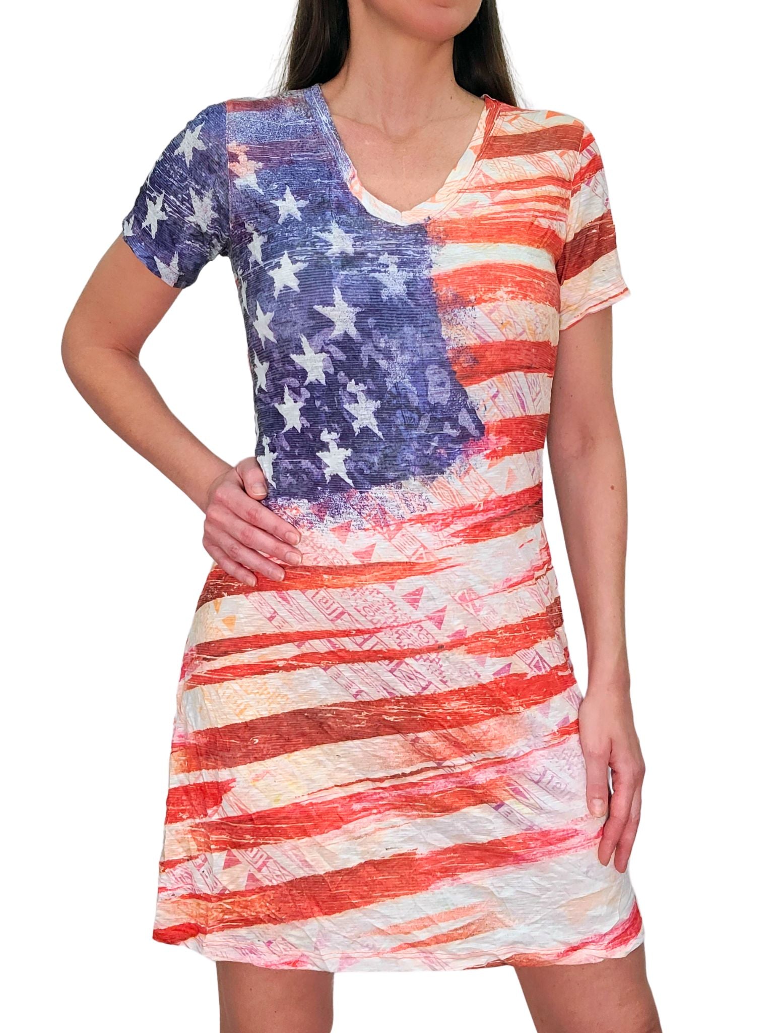 Free-spirited V-neck T-shirt dress with hand-painted American flag motif. Washed-out red brushstroke stripes, white stars on blue watercolor wash, on flowy fabric for music festivals or Fourth of July parties. Effortless boho patriotism